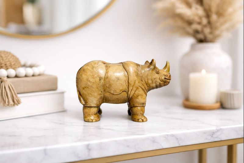 hand carved soapstone rhino sculpture decorative stone figurine on marble table with candle decor