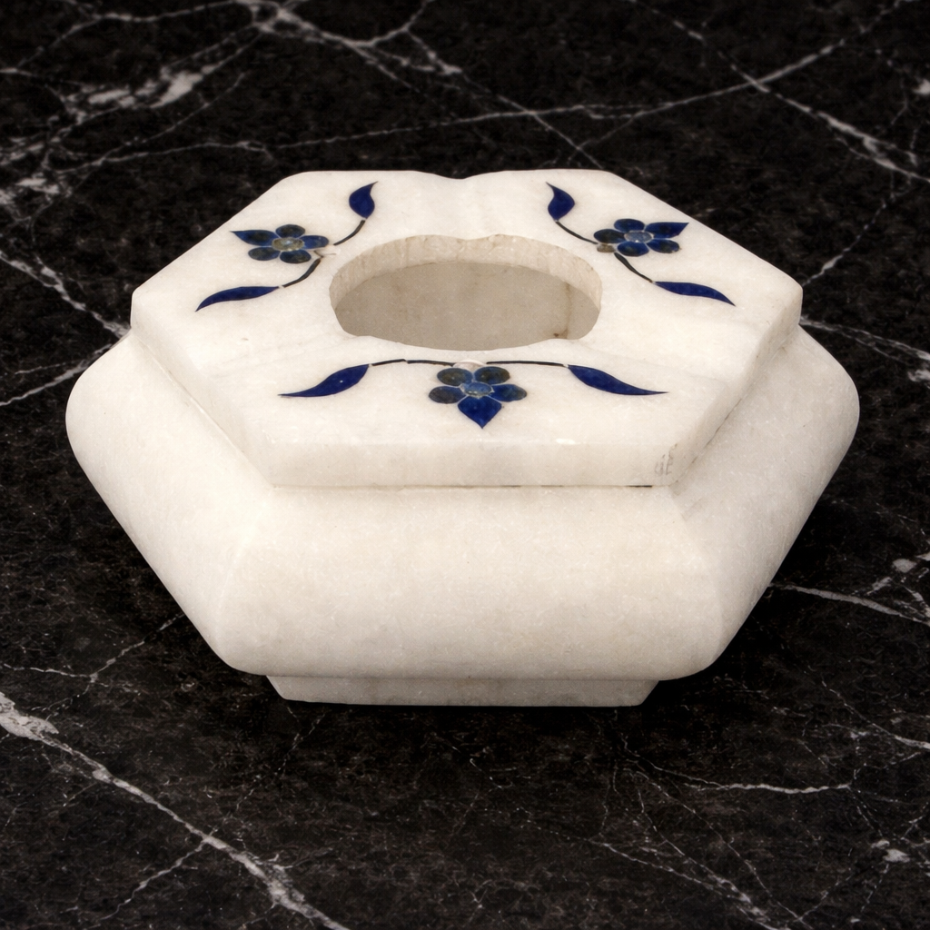 0.255 kg White marble hexagon ashtray with blue floral inlay on dark marble background