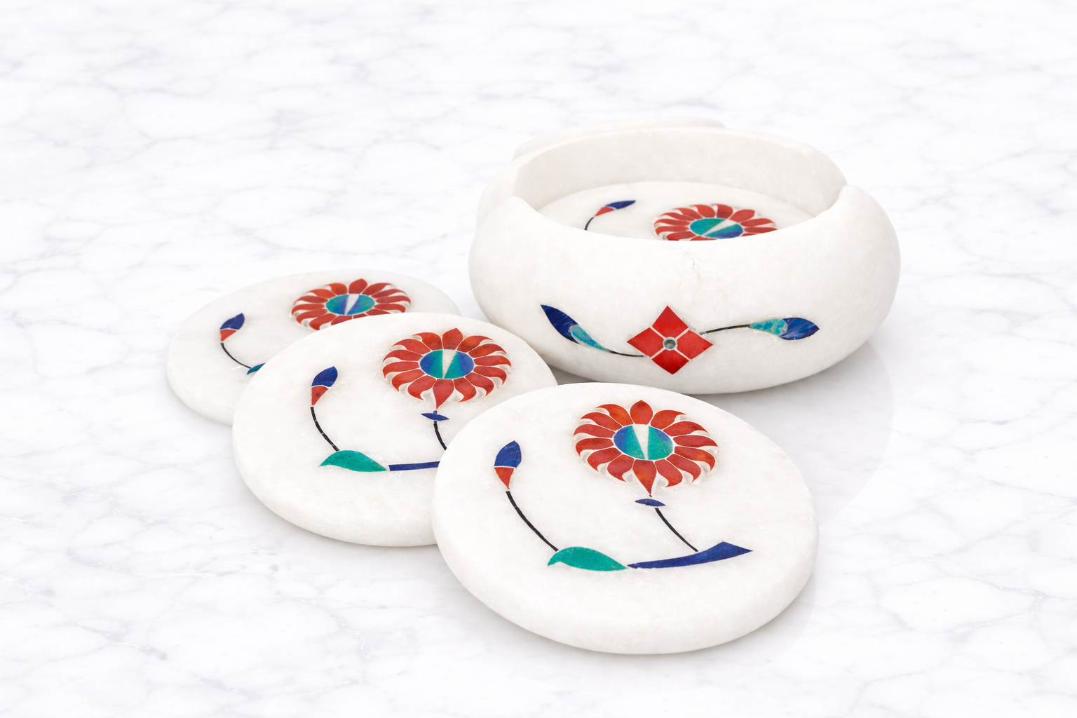 set of six white marble coasters with colourful floral inlay design