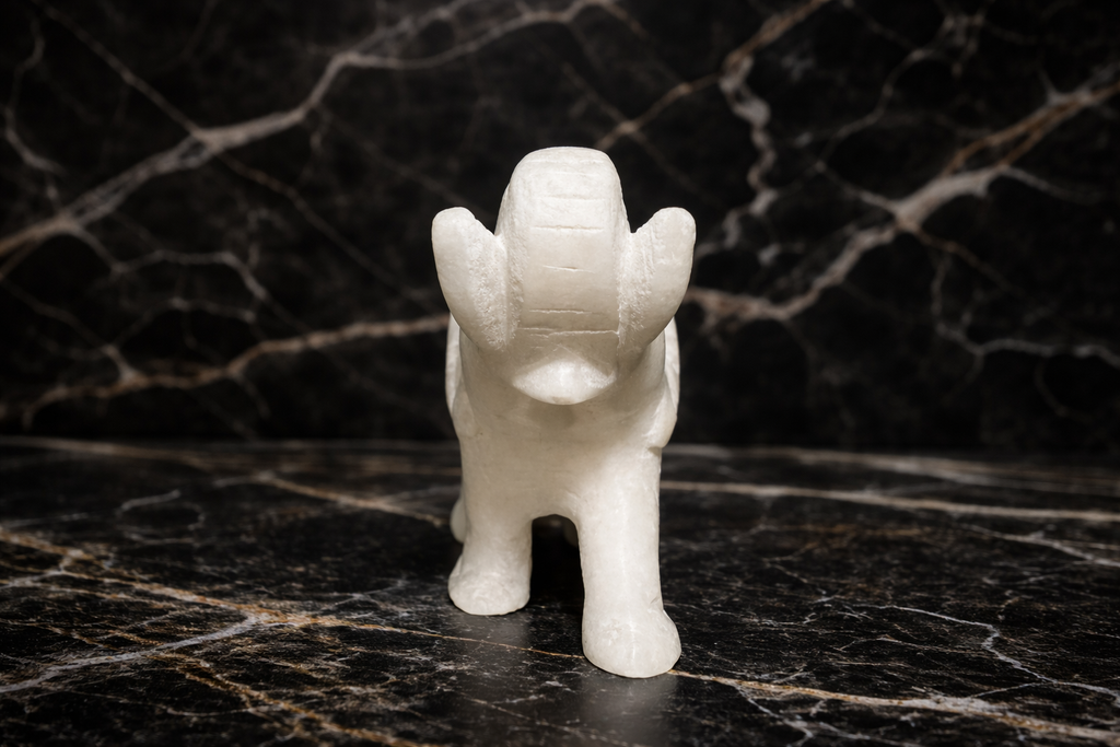 Front view of intricate white marble elephant sculpture elephant within elephant design