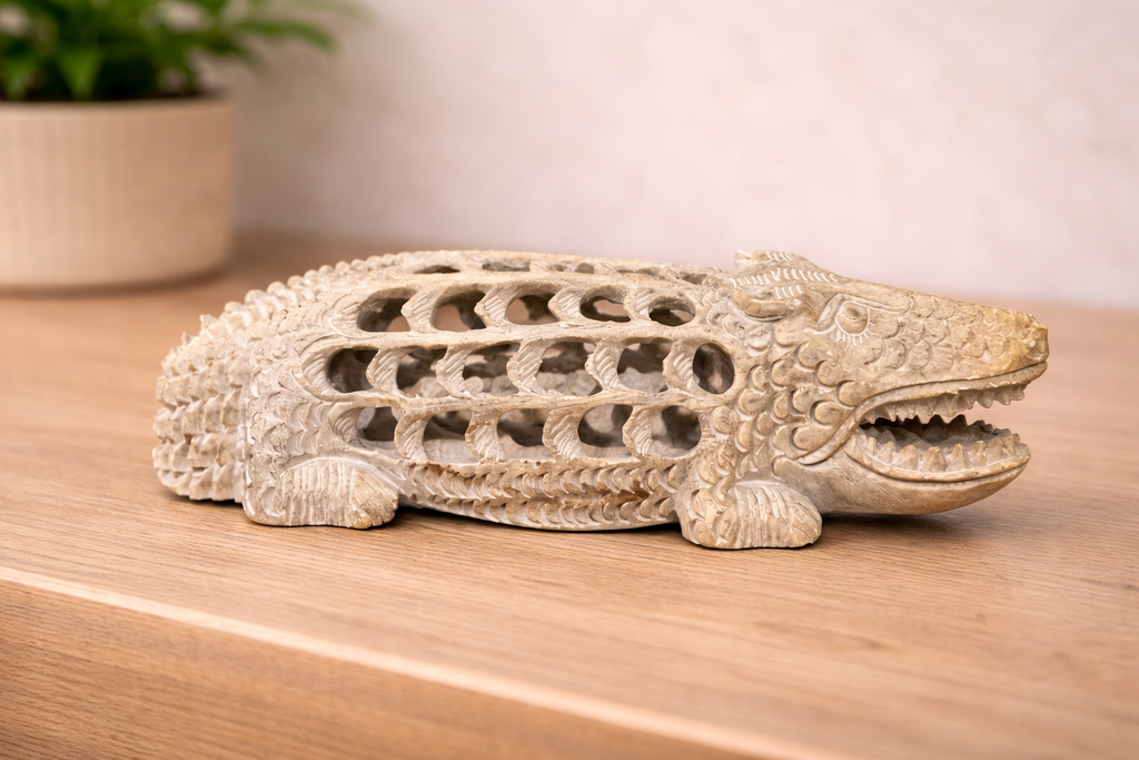 0.96 kg hand-carved soapstone crocodile figurine with intricate hollow carving displayed on wooden surface