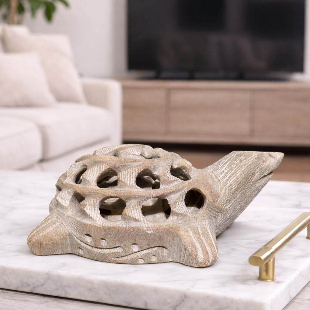 White marble turtle figurine displayed on marble table neutral home décor setting