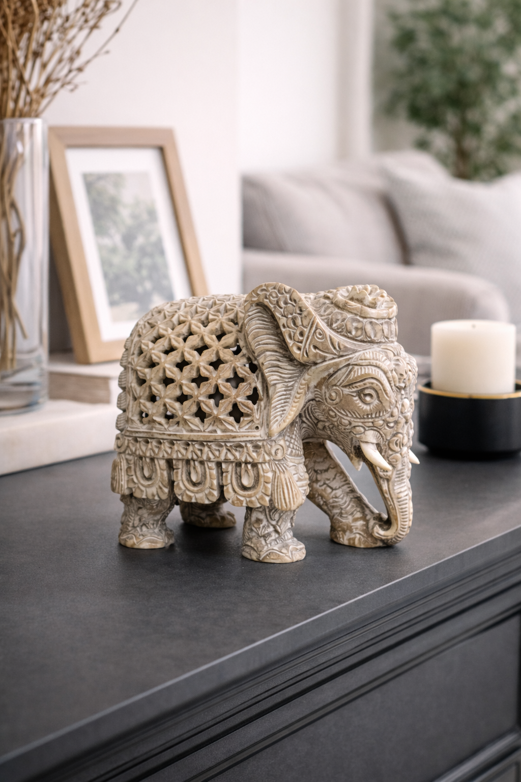 Soapstone elephant statue with intricate carvings styled in modern home interior New Zealand decor