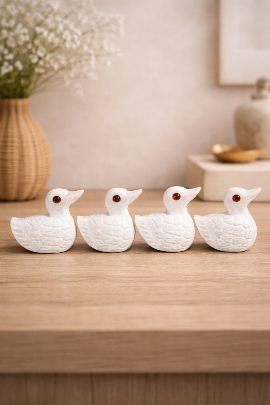 Hand-carved white marble duck figurine set, white color, polished finish, red stone eyes