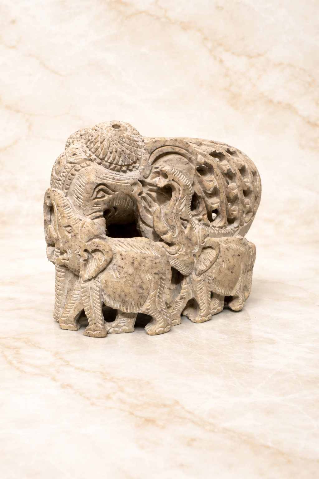 Curved soapstone mother and baby elephant sculpture symbolising protection