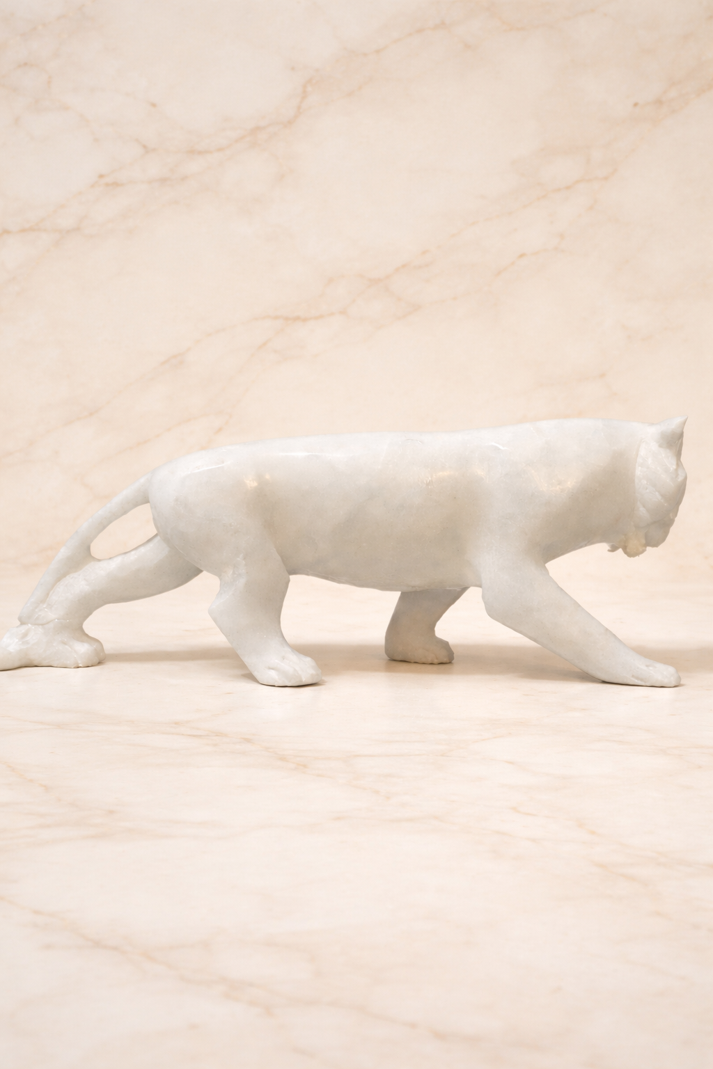 Side view for a White marble tiger sculpture with roaring expression