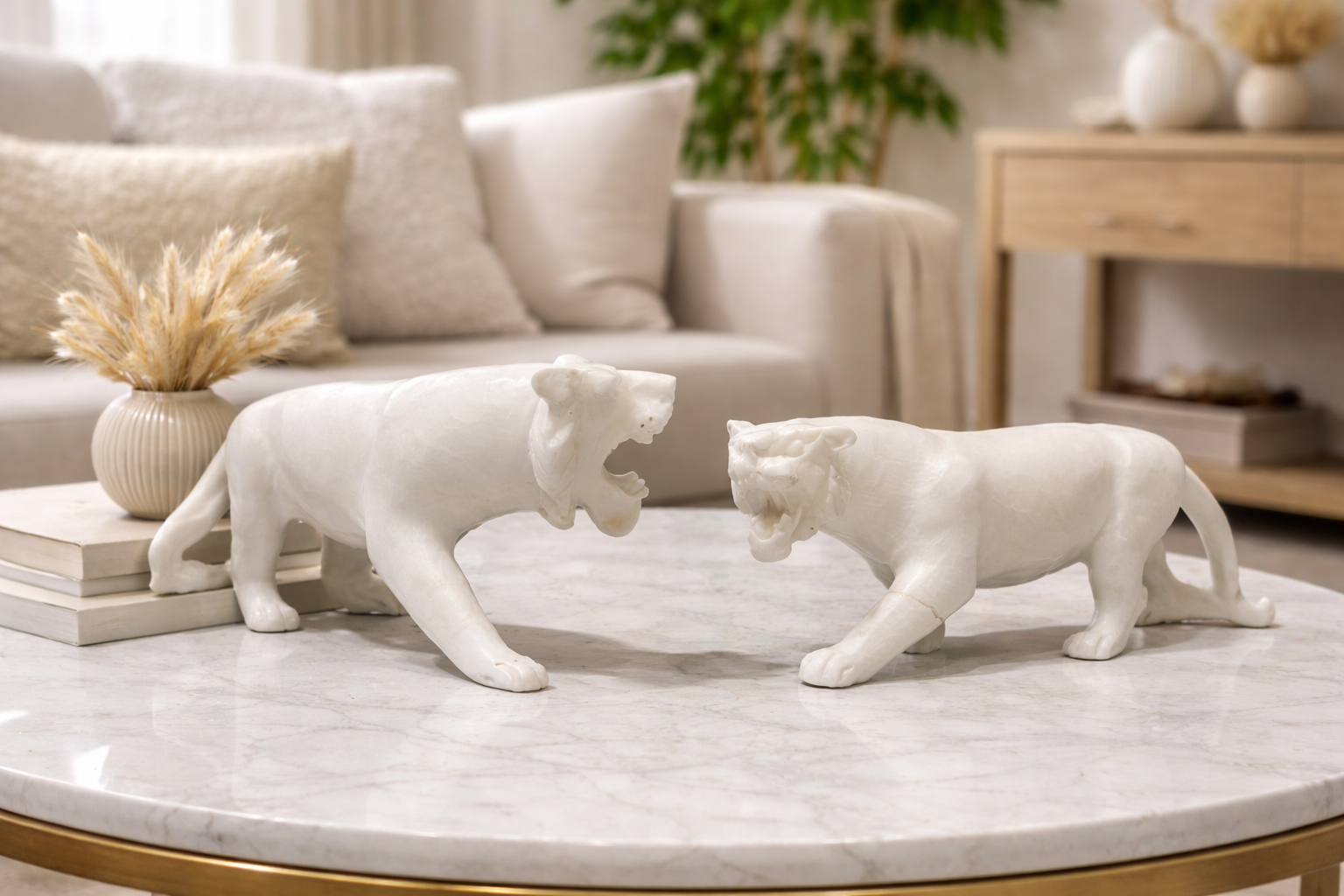 Two white marble tiger sculptures on marble table, luxury natural stone decor for modern NZ homes.