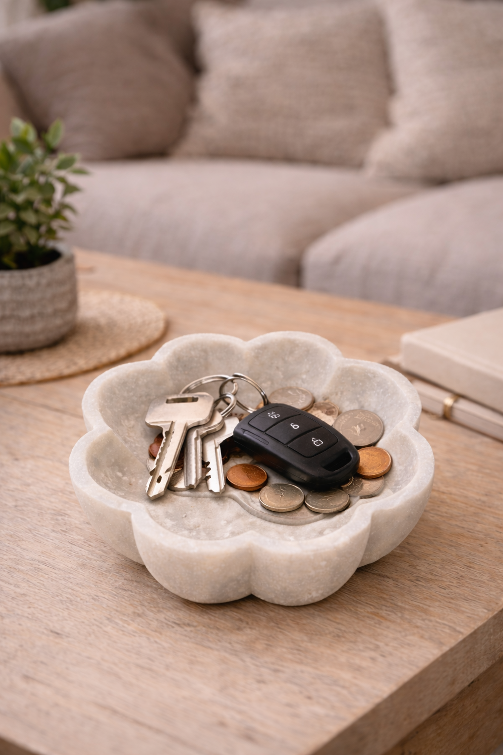 White marble lotus decorative bowl used as key holder on coffee table
