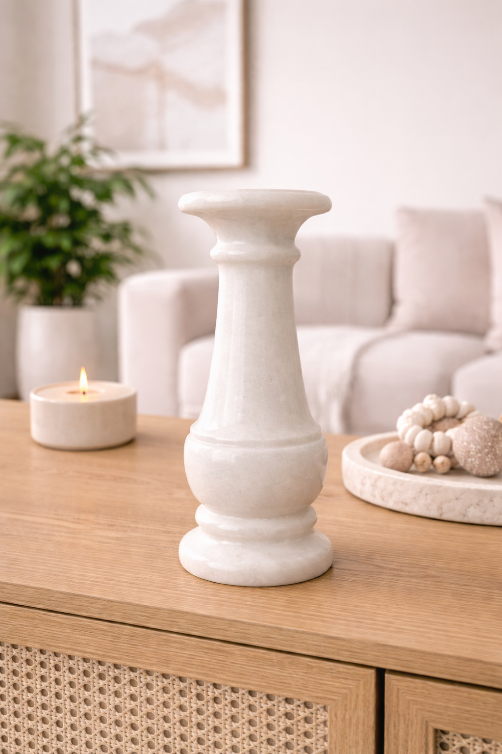 White marble candle holder on a living room coffee table