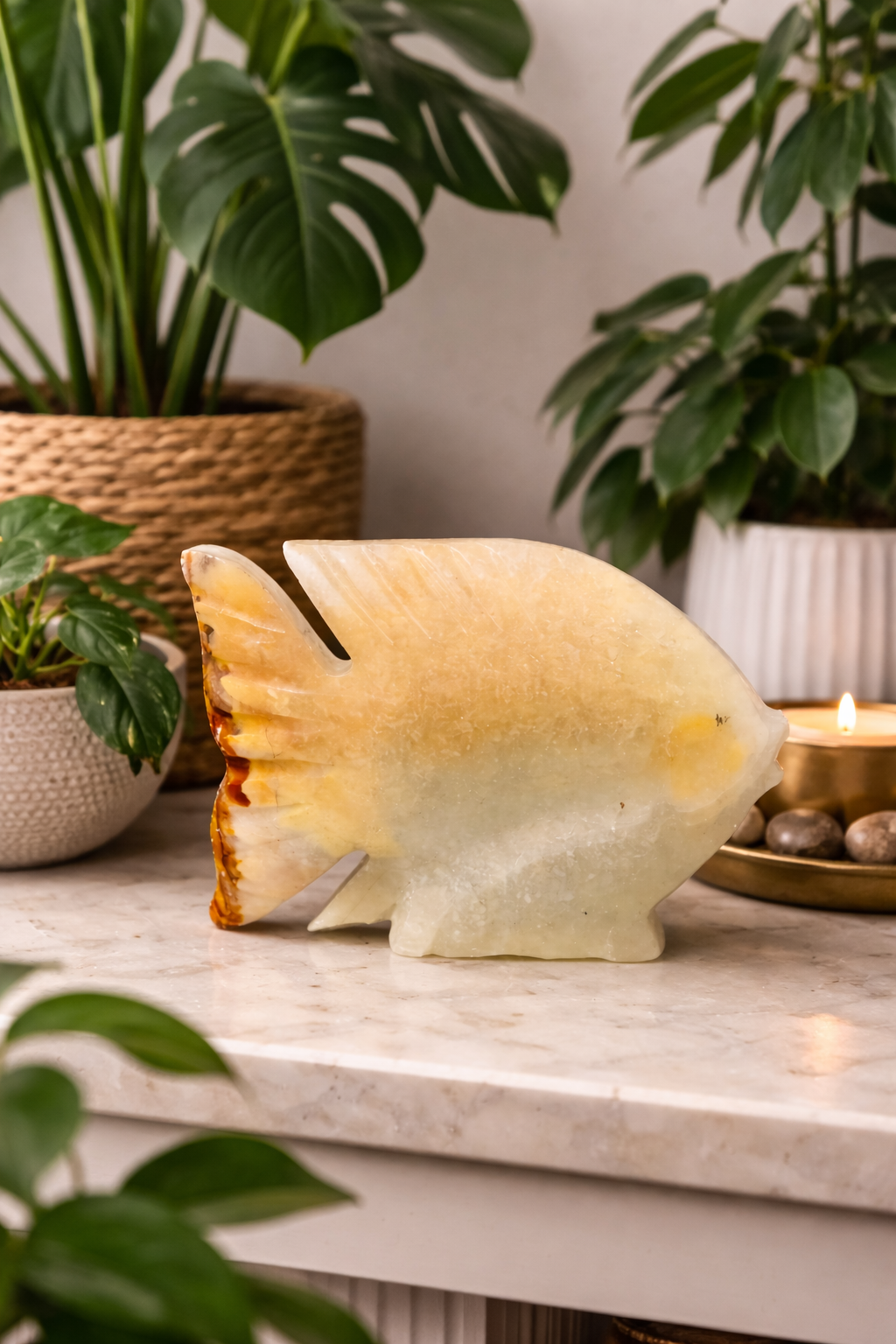 Hand-carved onyx fish sculpture styled with Indore plants