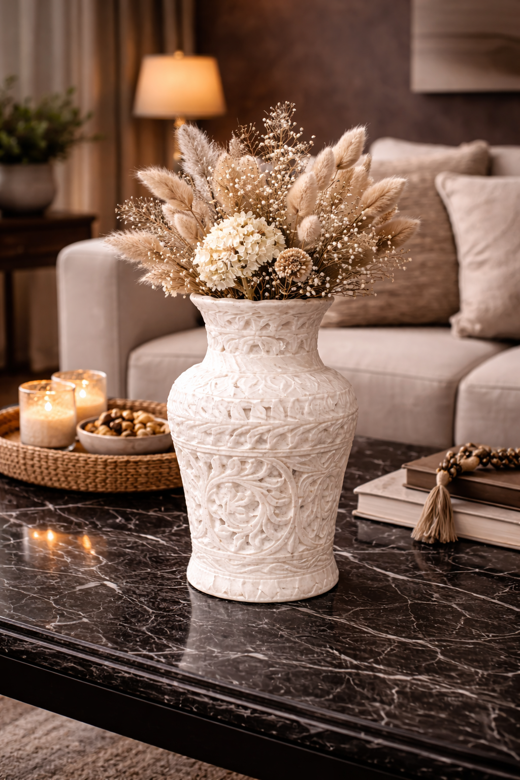 Hand-carved white marble vase with dried flowers styled as a centrepiece