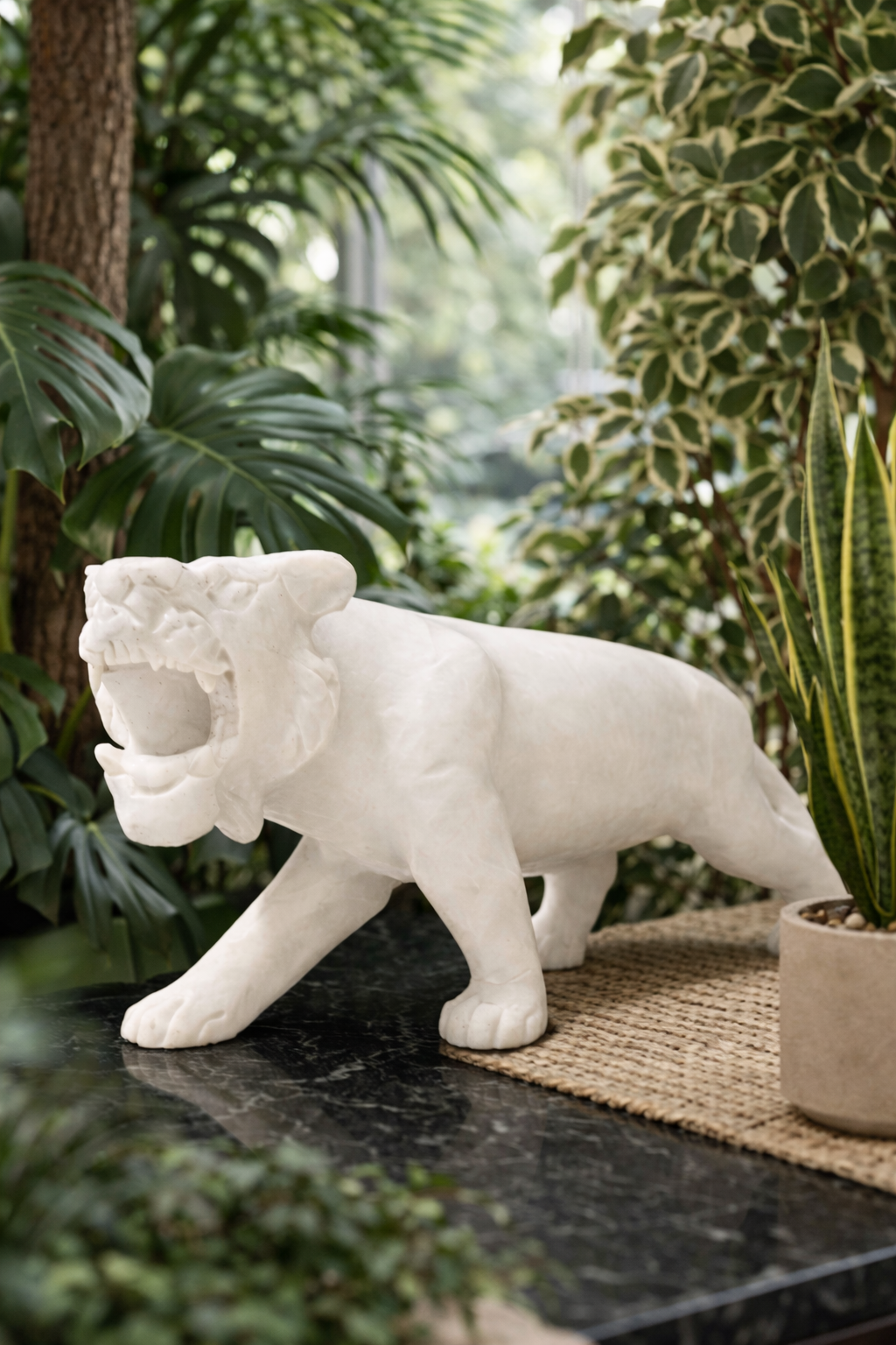 White marble tiger sculpture with Indore plants