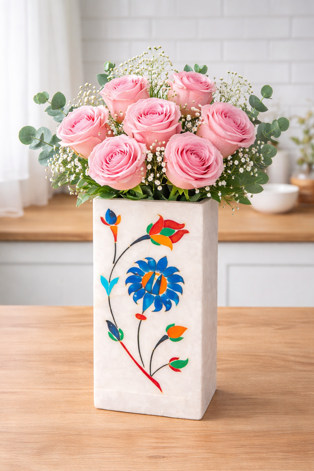 White marble multipurpose stand with floral inlay used as small decorative vase for single stem on wooden table