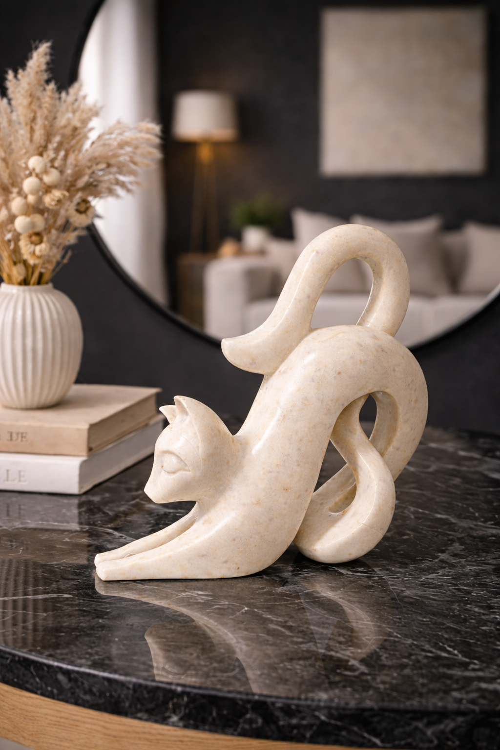 Polished white marble cat sculpture on black marble console table with mirror backdrop, premium home décor NZ