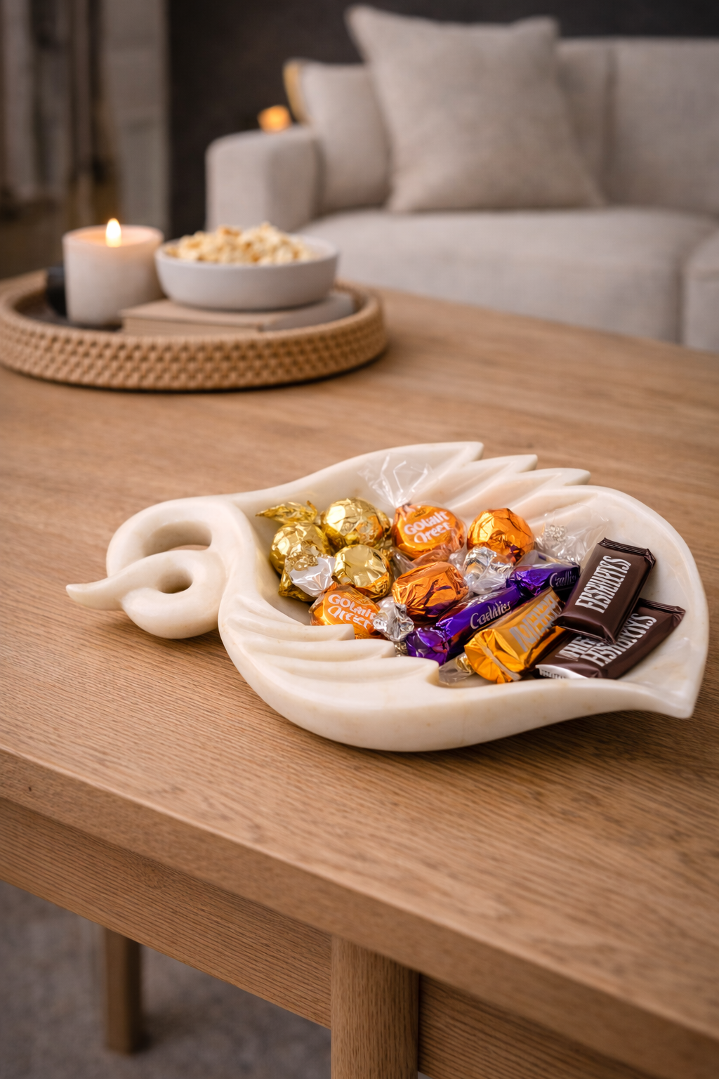 White marble leaf bowl used as decorative candy holder on table