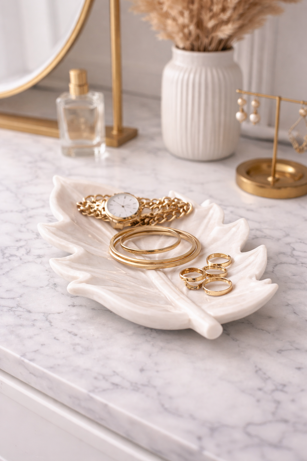 White marble leaf-shaped bowl used as a jewellery holder for rings and bracelets