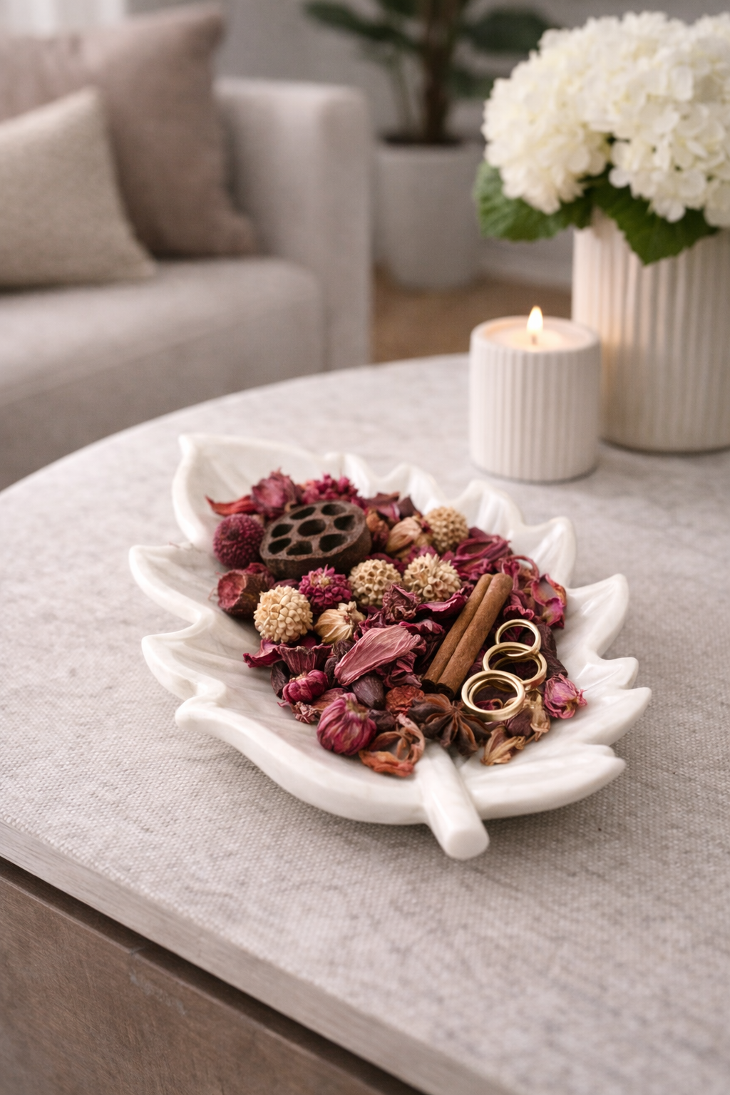 Solid white marble leaf bowl styled with potpourri as a centrepiece accent.
