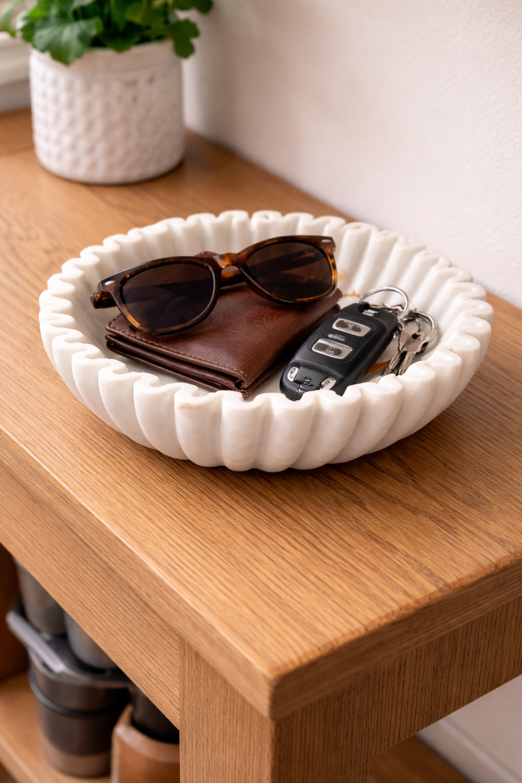 Hand-carved white marble zigzag decorative bowl used as entryway key holder on wooden console table, luxury home décor NZ