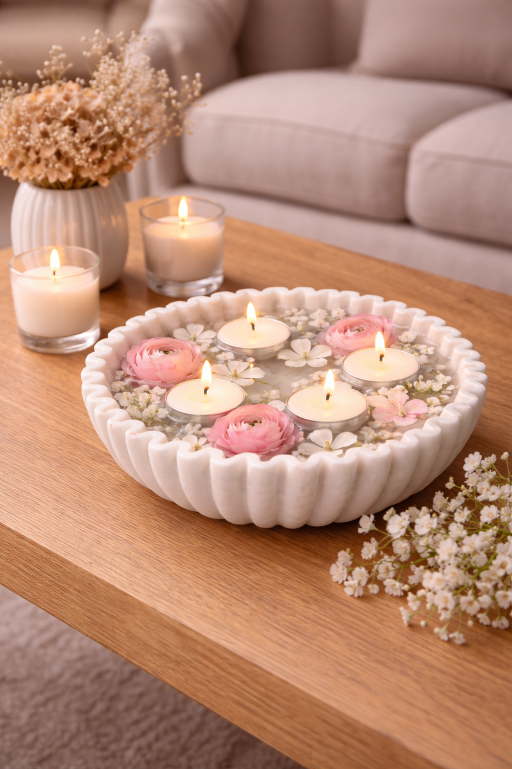 White marble decorative bowl styled with floating tealights and pink flowers for festive décor NZ