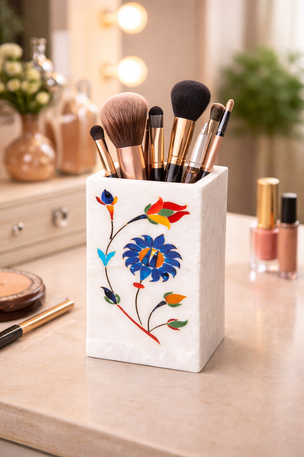 White marble multipurpose stand with floral inlay used as makeup brush holder