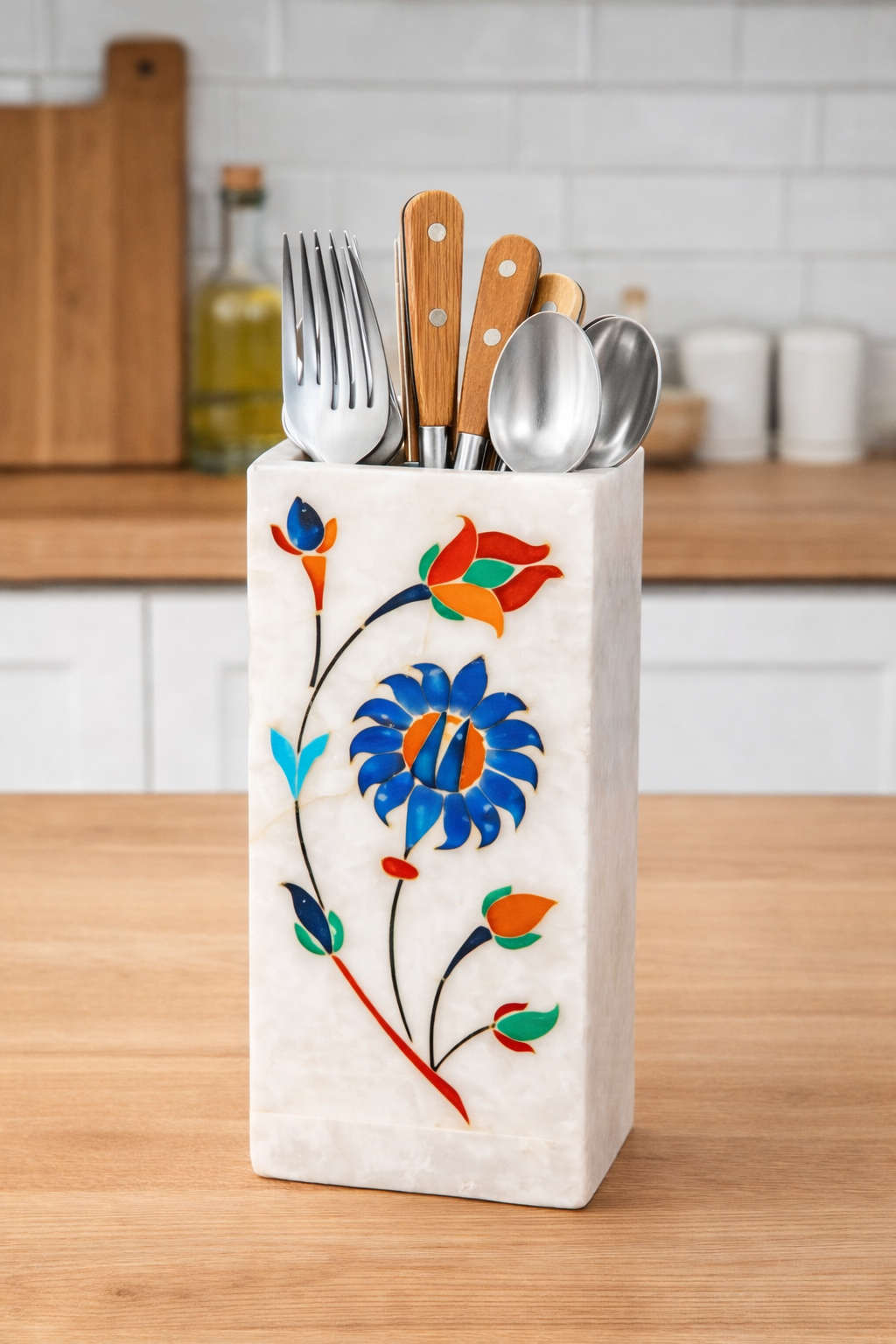 White marble multipurpose stand with handcrafted floral inlay used as small cutlery holder in Kitchen