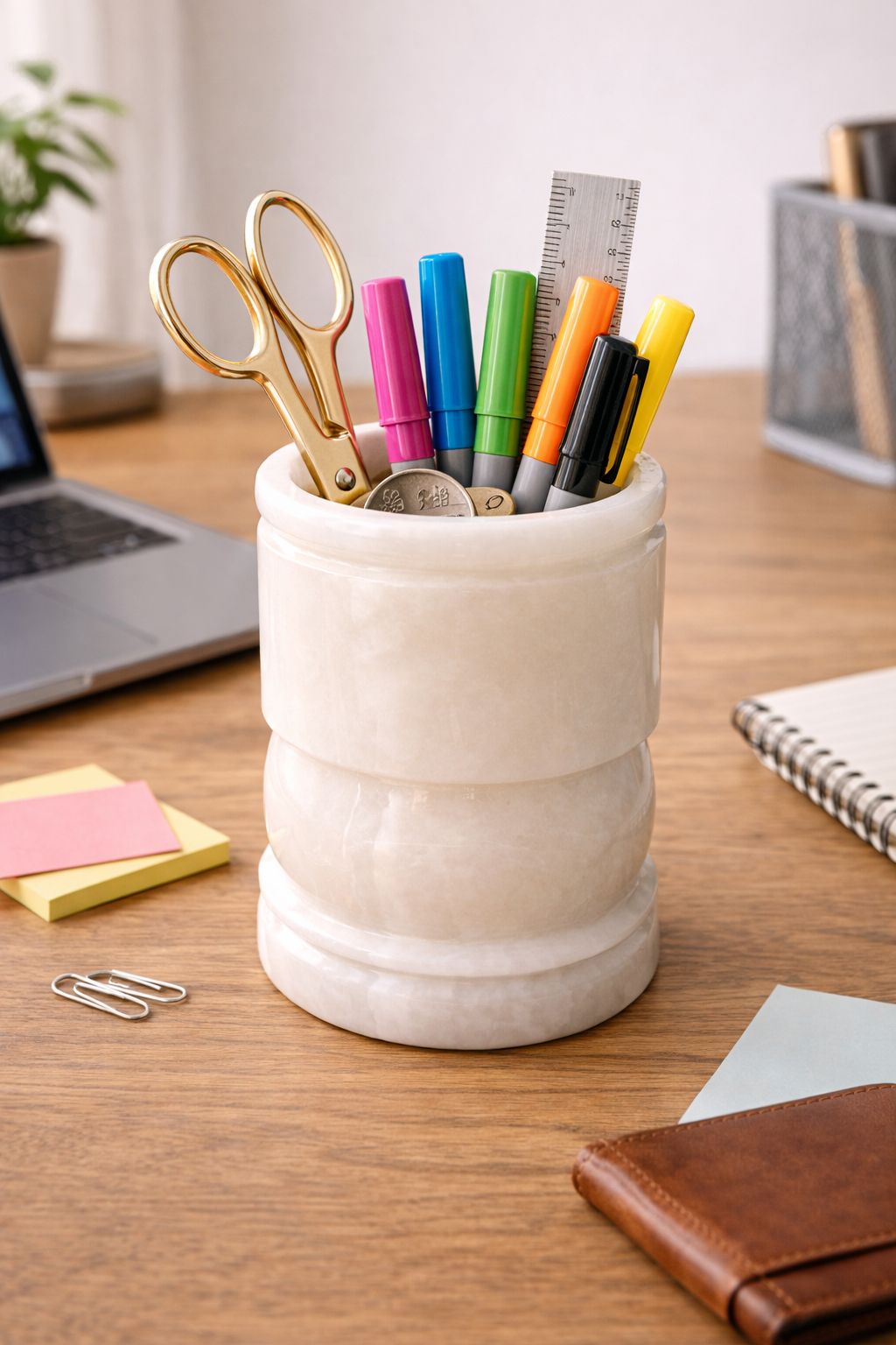 Polished natural onyx desk organiser holding pens, markers, and scissors in a modern workspace.