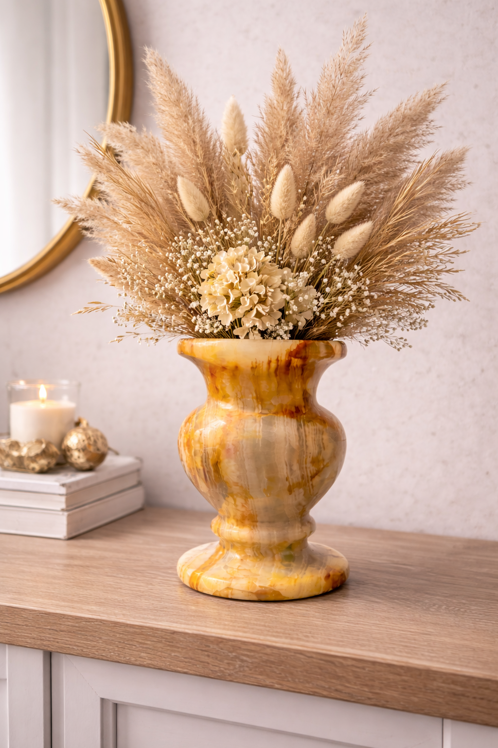 Natural onyx vase holding dried flowers on wooden table, premium stone centrepiece for NZ interiors.