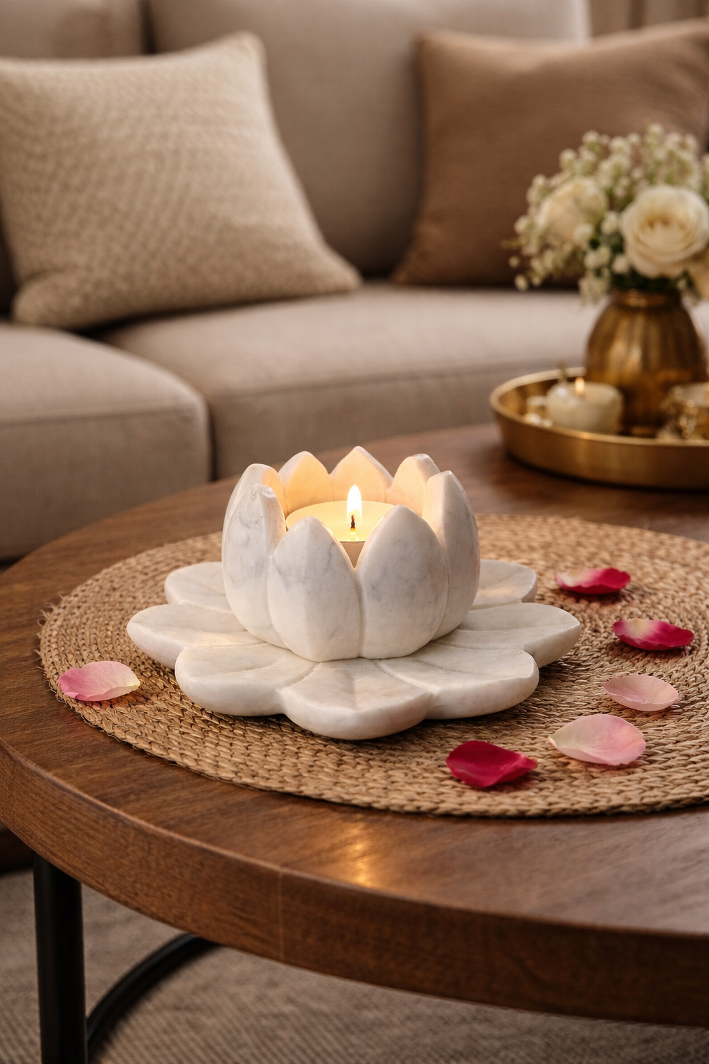 Hand-carved white marble lotus tealight holder with lit candle on wooden coffee table, luxury living room décor NZ