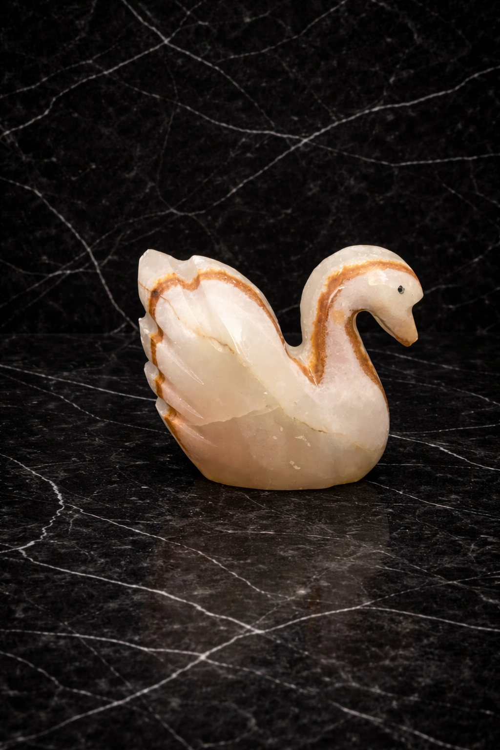 Natural onyx swan figurine carved from polished stone