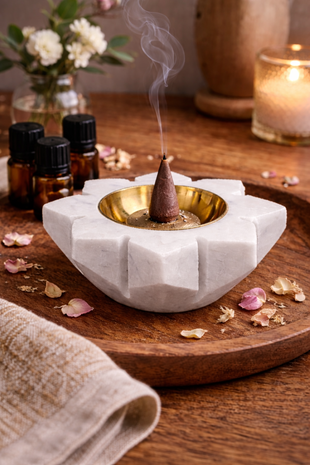 White marble lotus candle holder with brass cup and lit tealight, serene meditation décor NZ