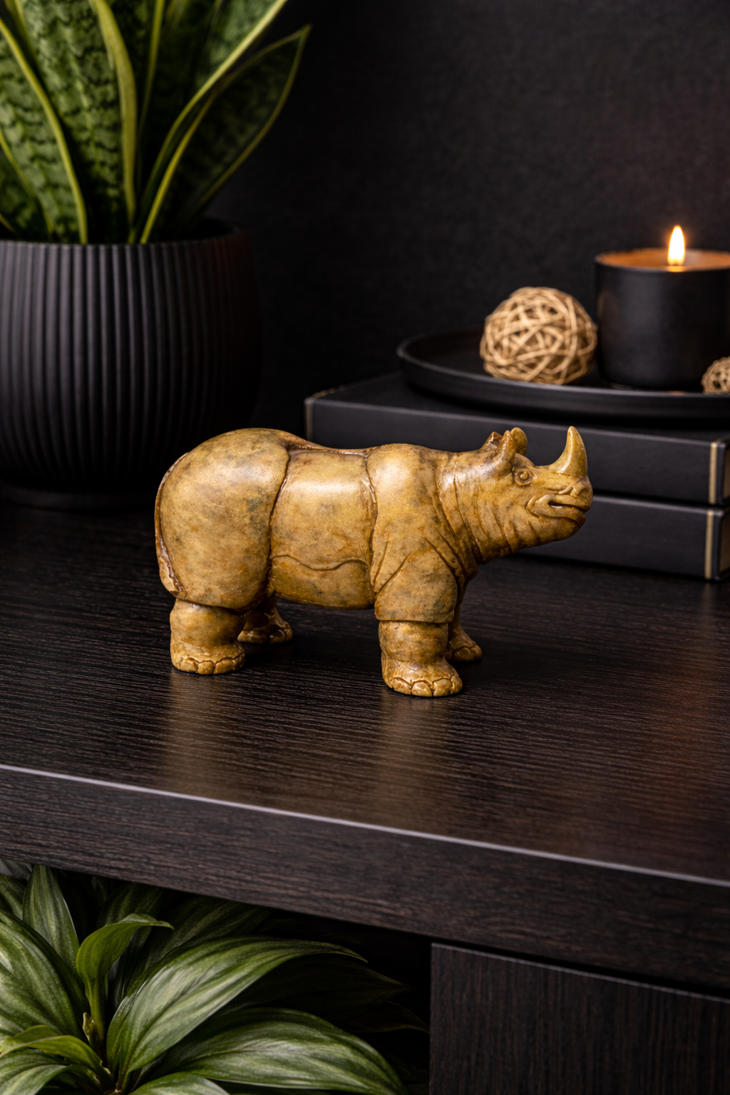 hand carved soapstone rhino sculpture decorative stone animal figurine on dark wood table