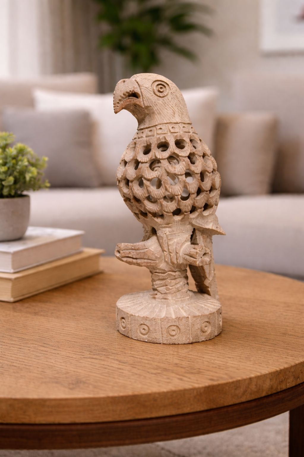 Hand-carved soapstone parrot sculpture styled on wooden table in modern living room setting