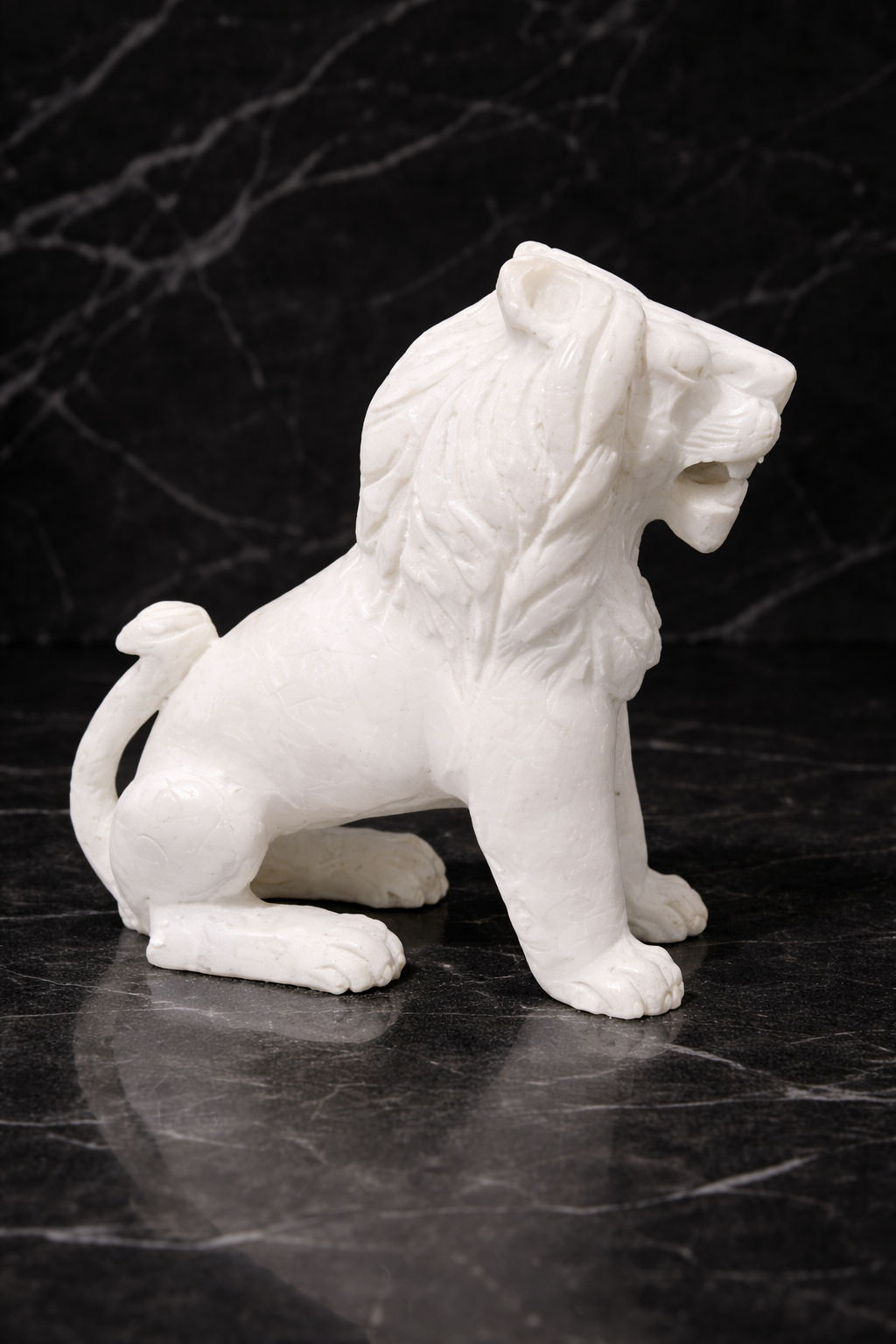 white marble lion statue with carved mane, styled on stone surface