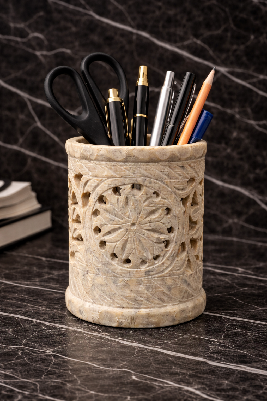 Luxury hand-carved soapstone floral stand used as a natural stone desk organiser