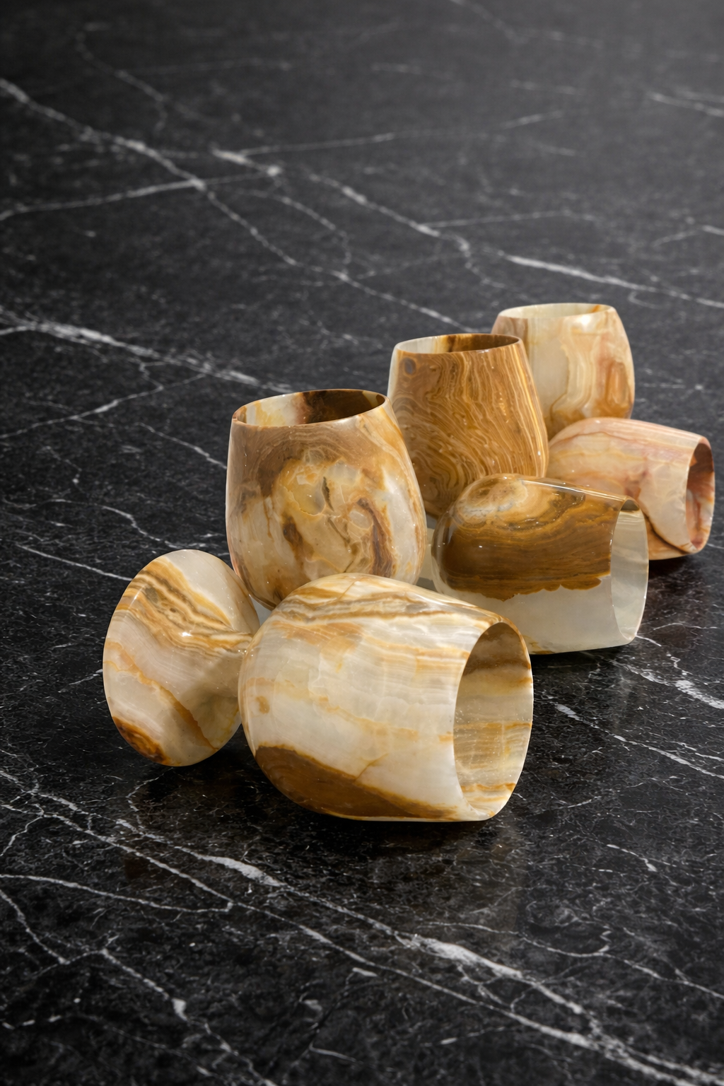 Polished natural onyx goblets with warm honey tones