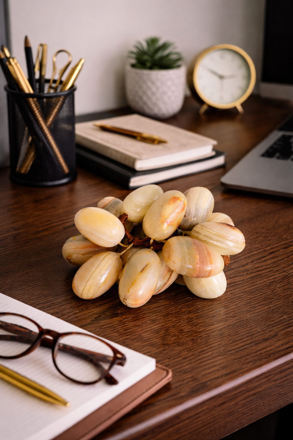 Natural onyx grapes decorative set styled on modern office desk