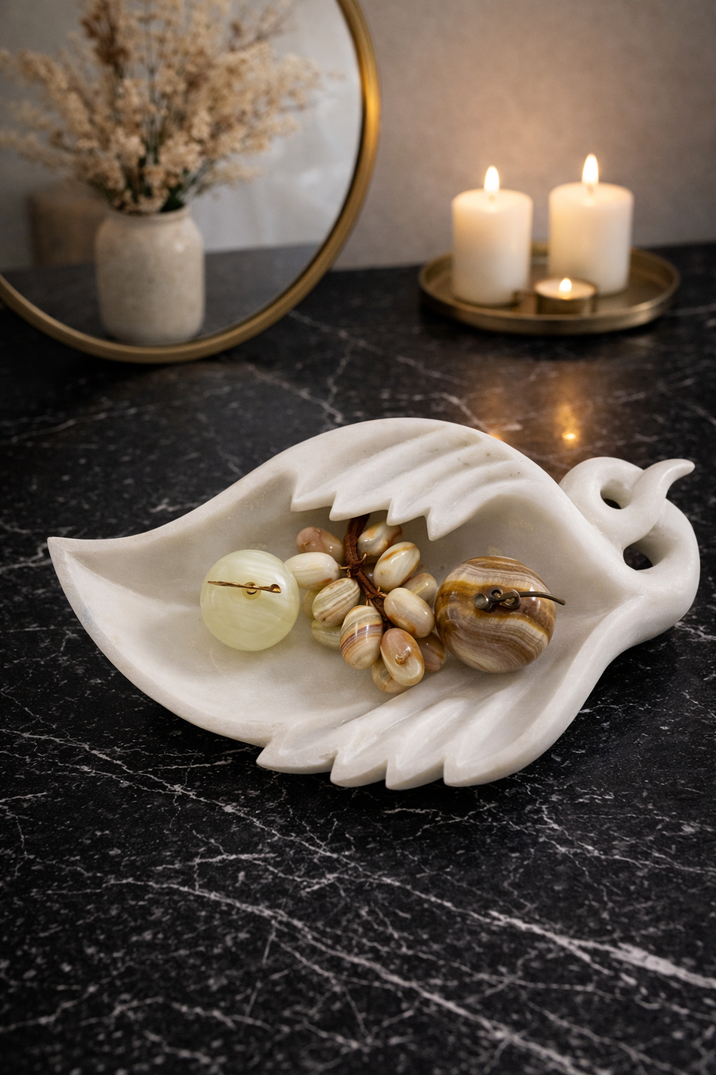 Natural onyx grapes decorative cluster styled in marble tray with onyx apple