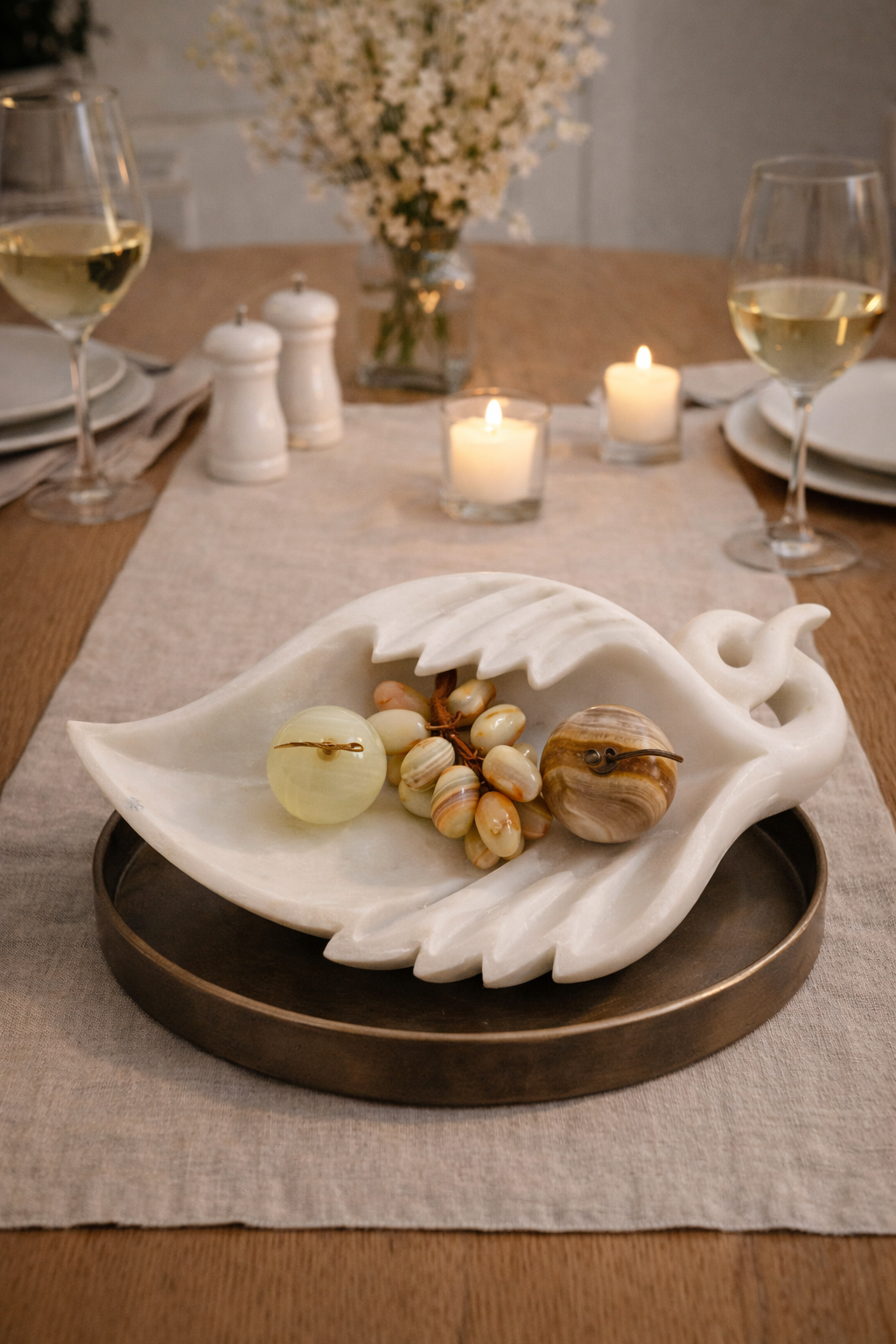 Natural onyx grapes decorative cluster styled in marble tray with onyx apple