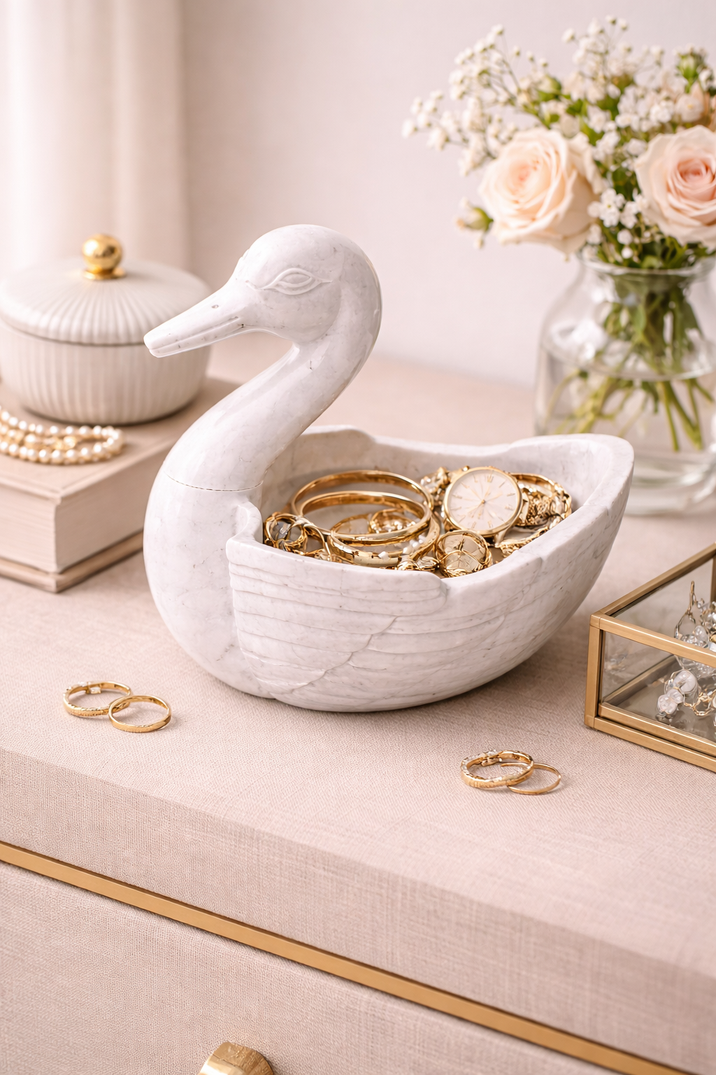 White marble duck bowl used as jewellery and accessory holder on bedside table, premium stone décor NZ