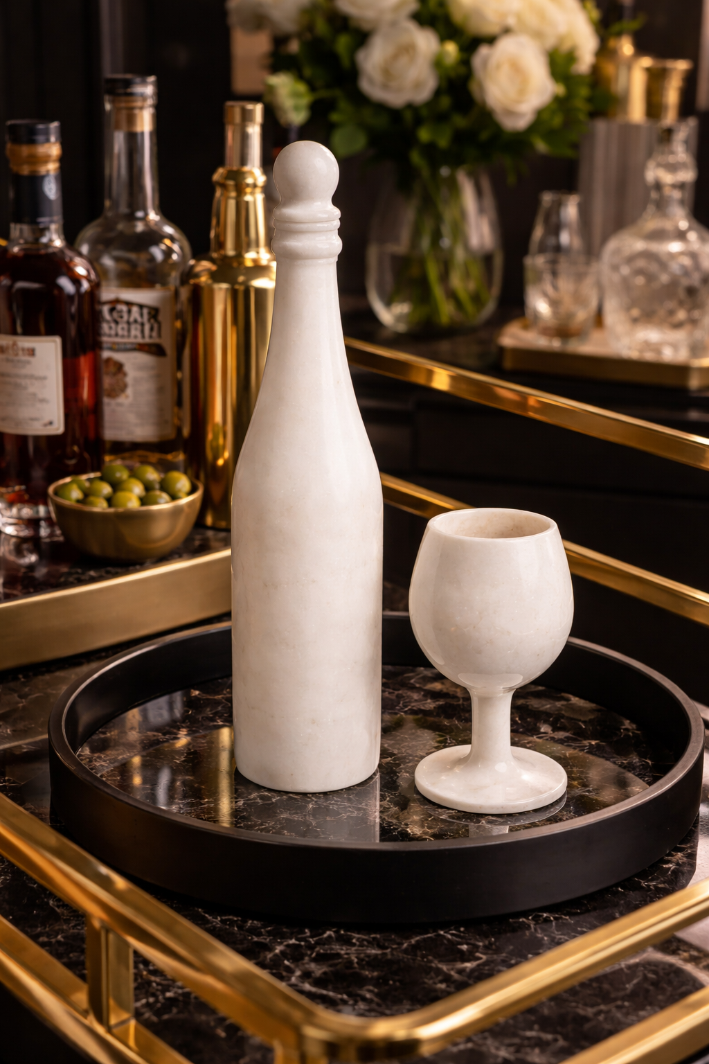 White marble wine bottle decor with matching marble goblet on black tray bar cart with gold accents – luxury home décor NZ