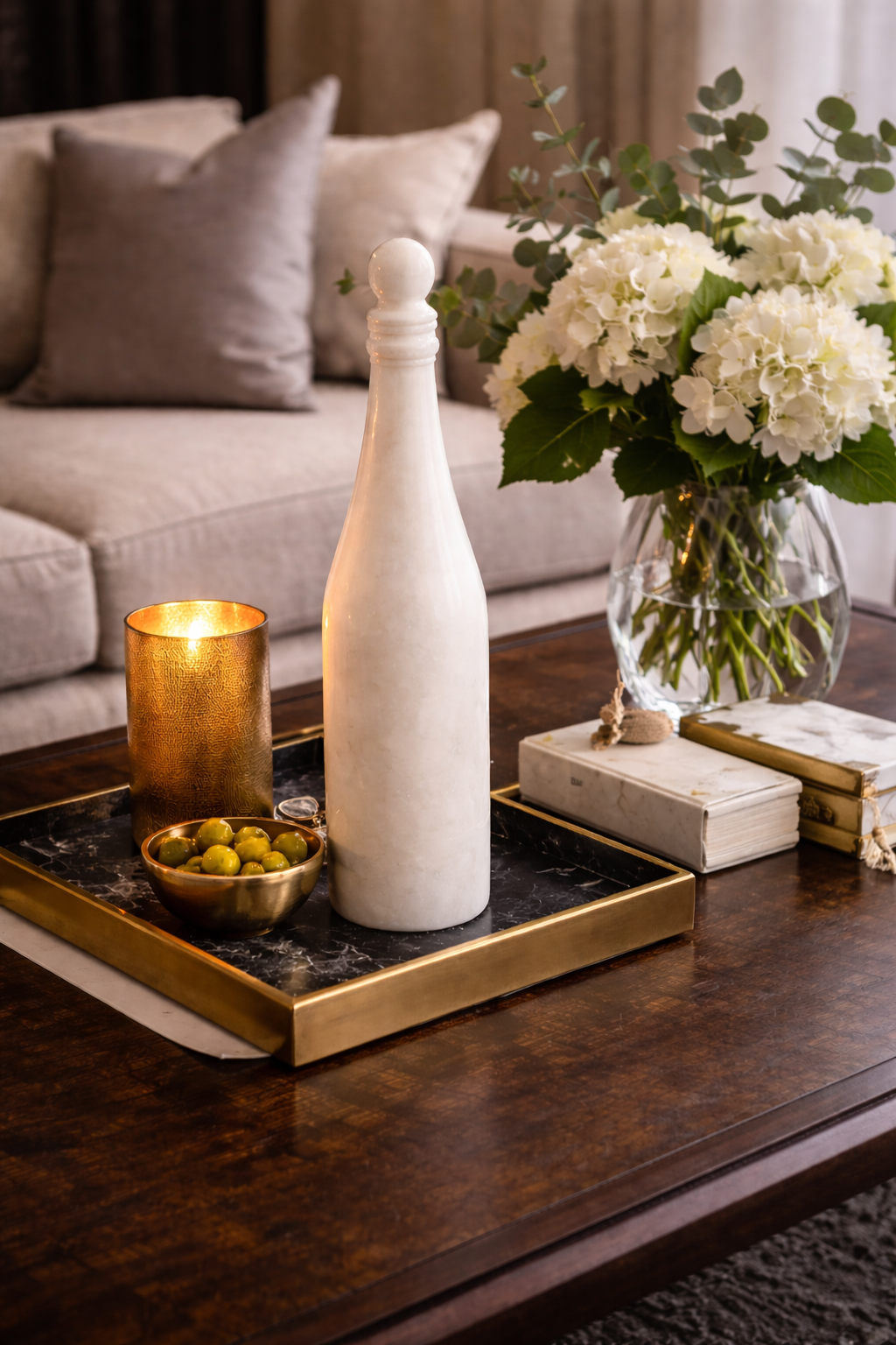 White marble wine bottle decor and goblet styled on table – luxury home decor NZ