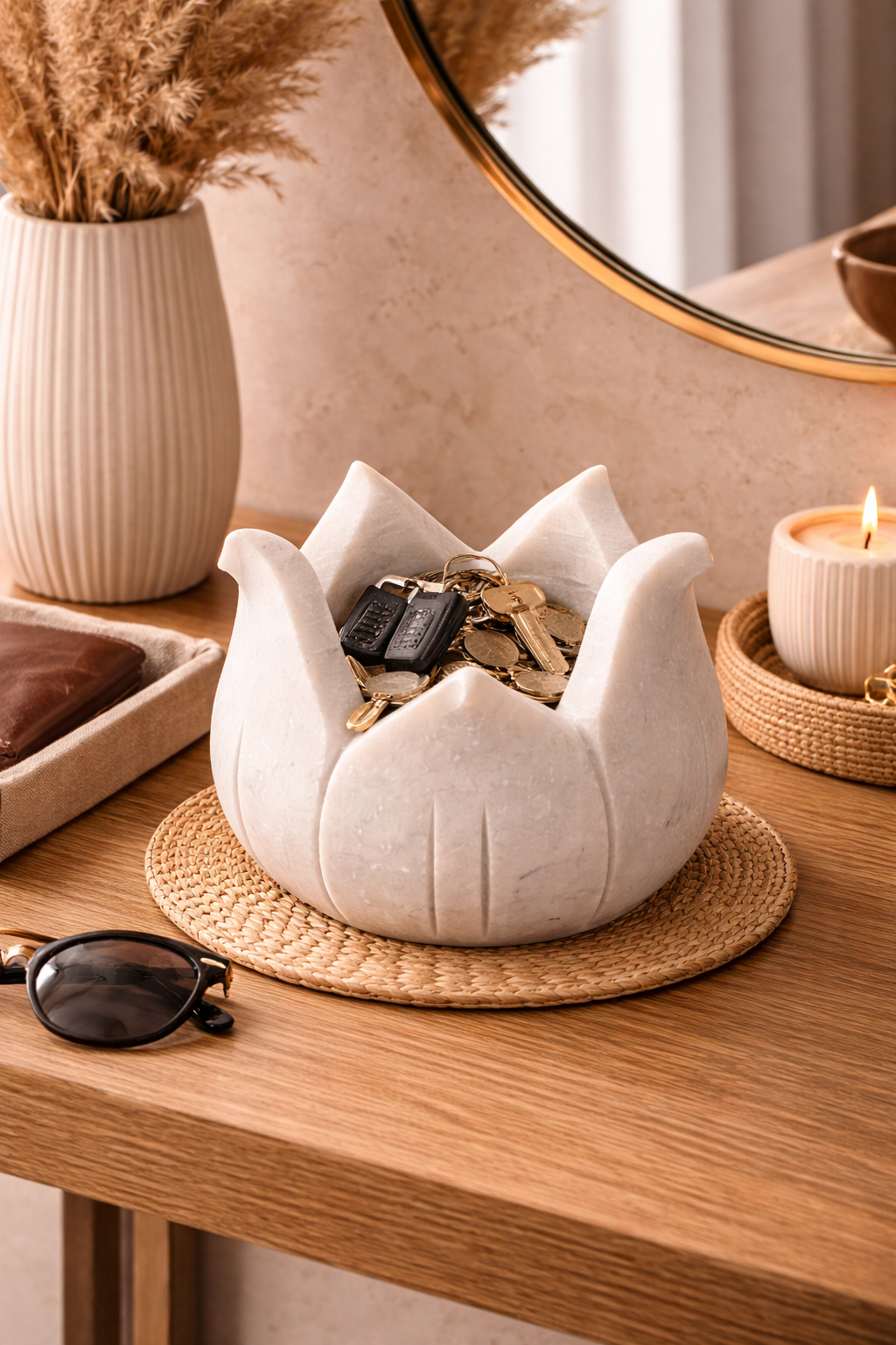Hand-carved marble lotus bowl for keys and coins on console table