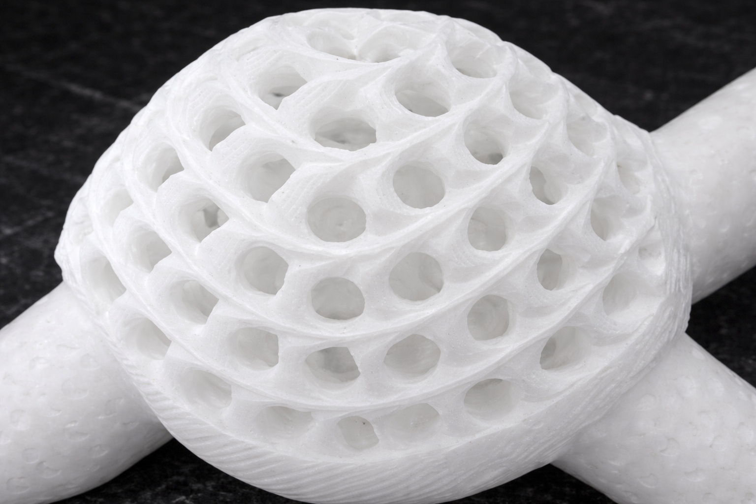 Close-up of decorative marble turtle figurine shell with detailed carving