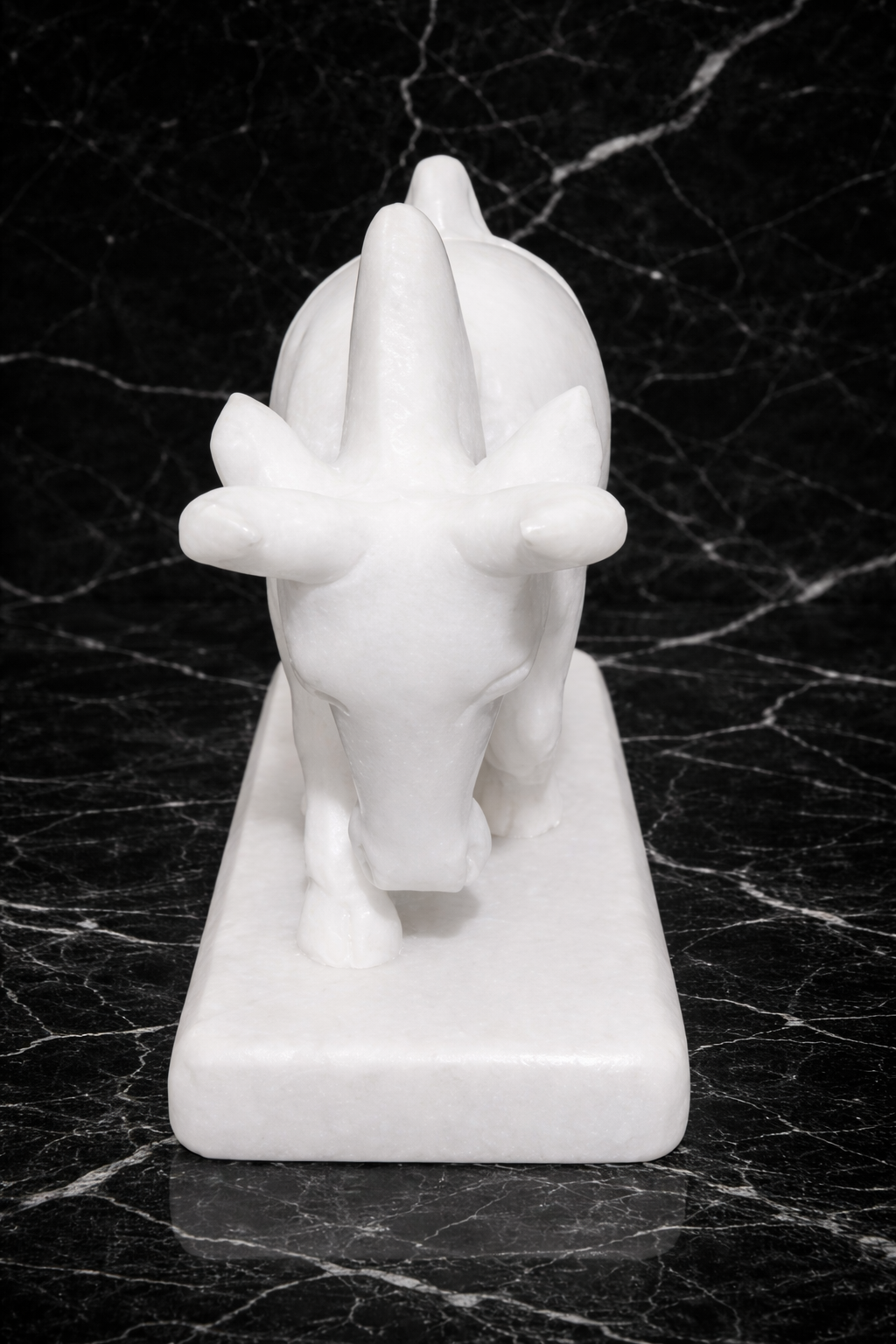 Front view of Luxury white marble bull statue symbolising strength and prosperity