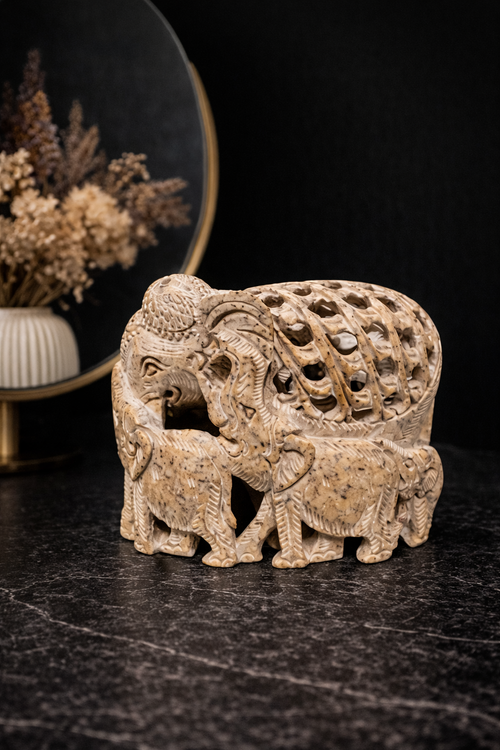 0.668 kg Intricately carved soapstone elephant family statue with mother and baby design displayed on dark marble surface