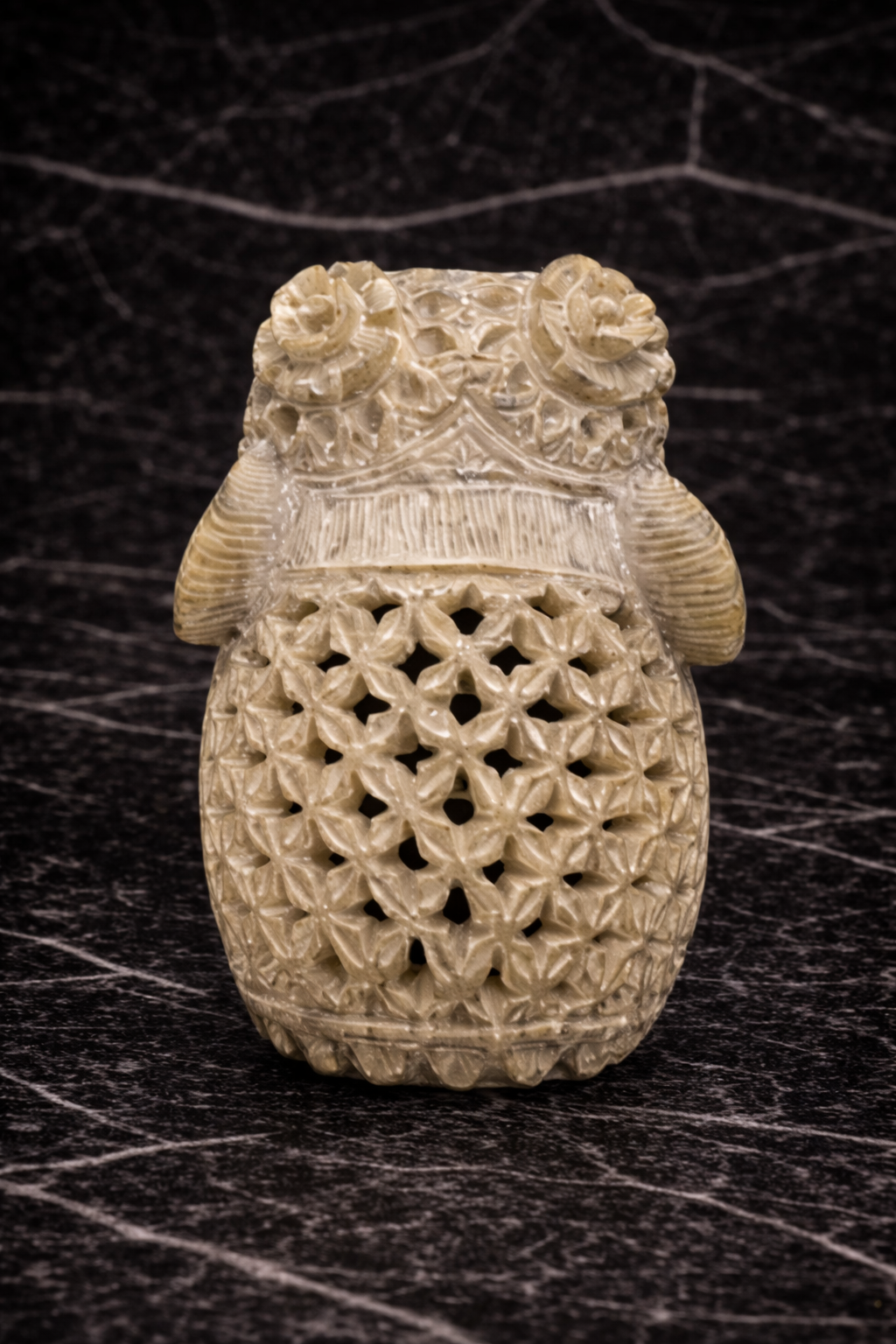 Close up back view of soapstone elephant sculpture showing detailed floral carvings and traditional artisan patterns NZ decor