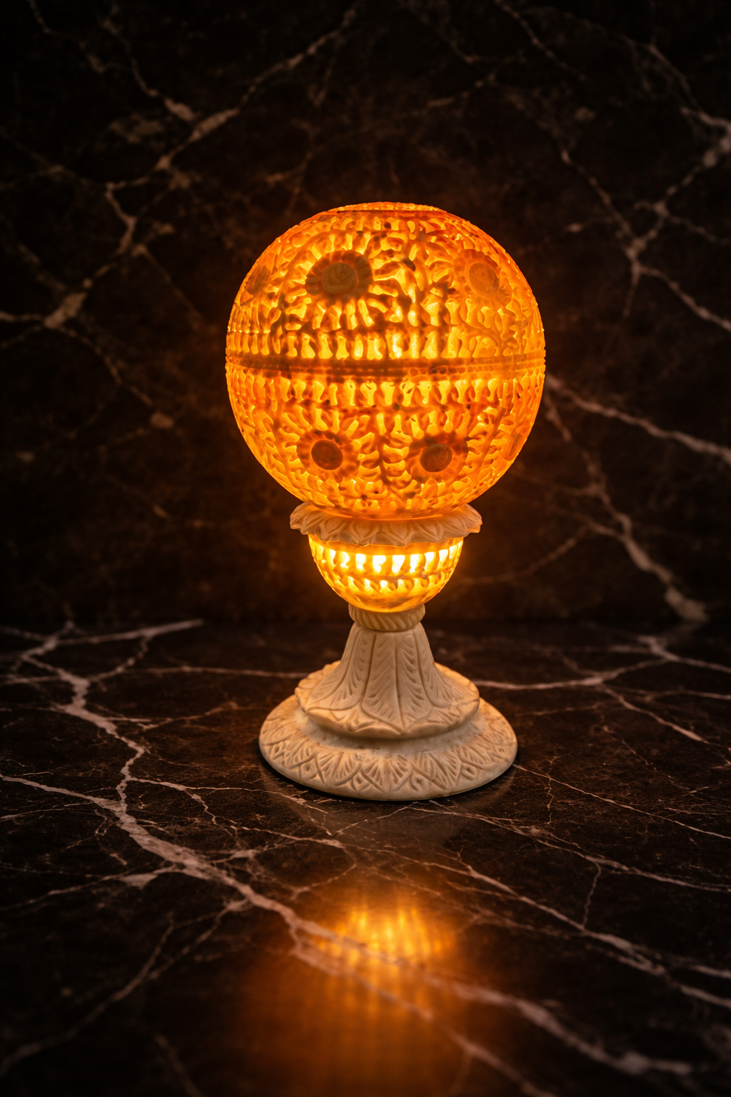 Hand-carved stone tealight holder glowing gently
