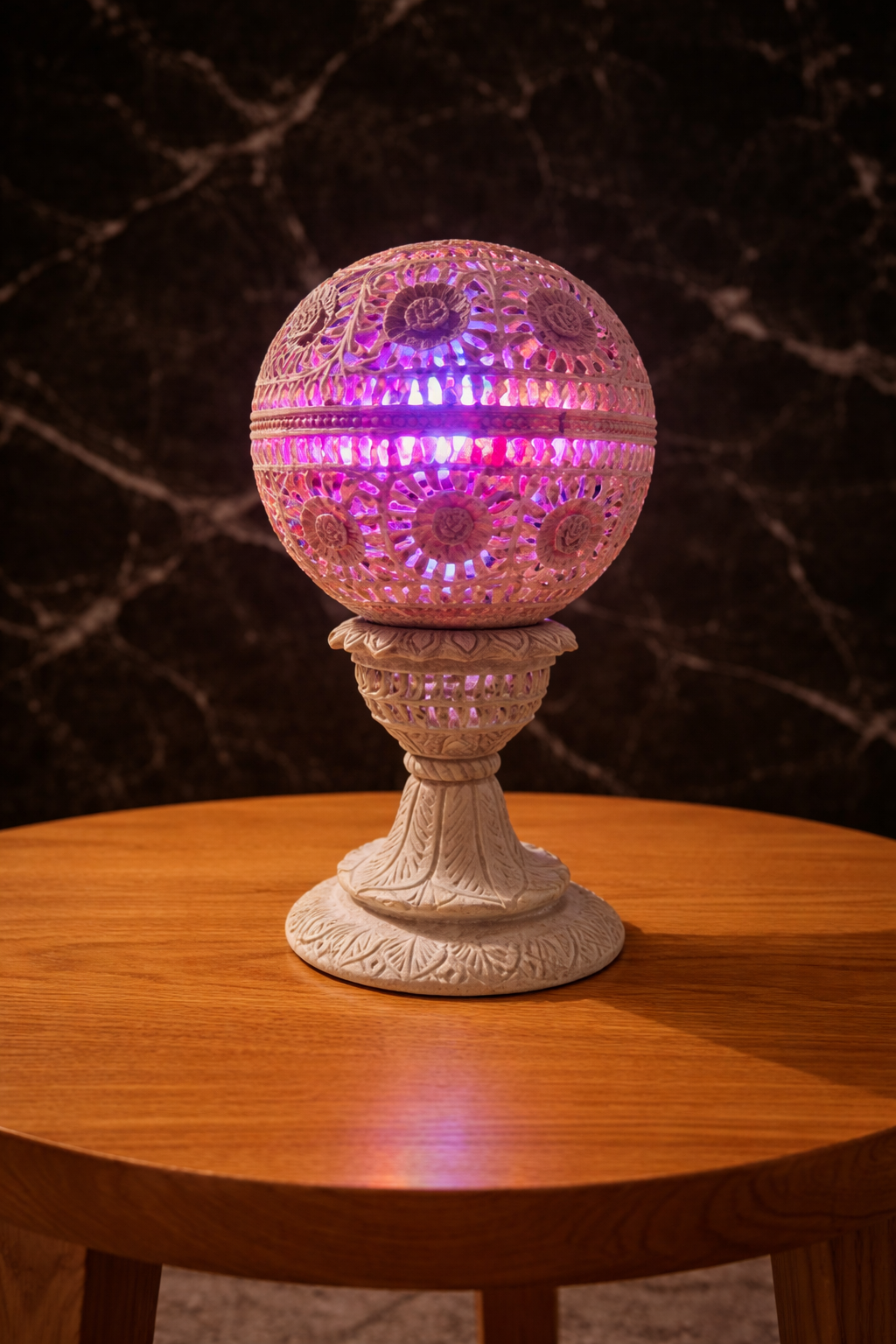 Soapstone floral tealight holder creating multicolour ambient light
