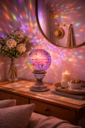 Hand-carved soapstone floral tealight holder casting colourful light patterns on wall