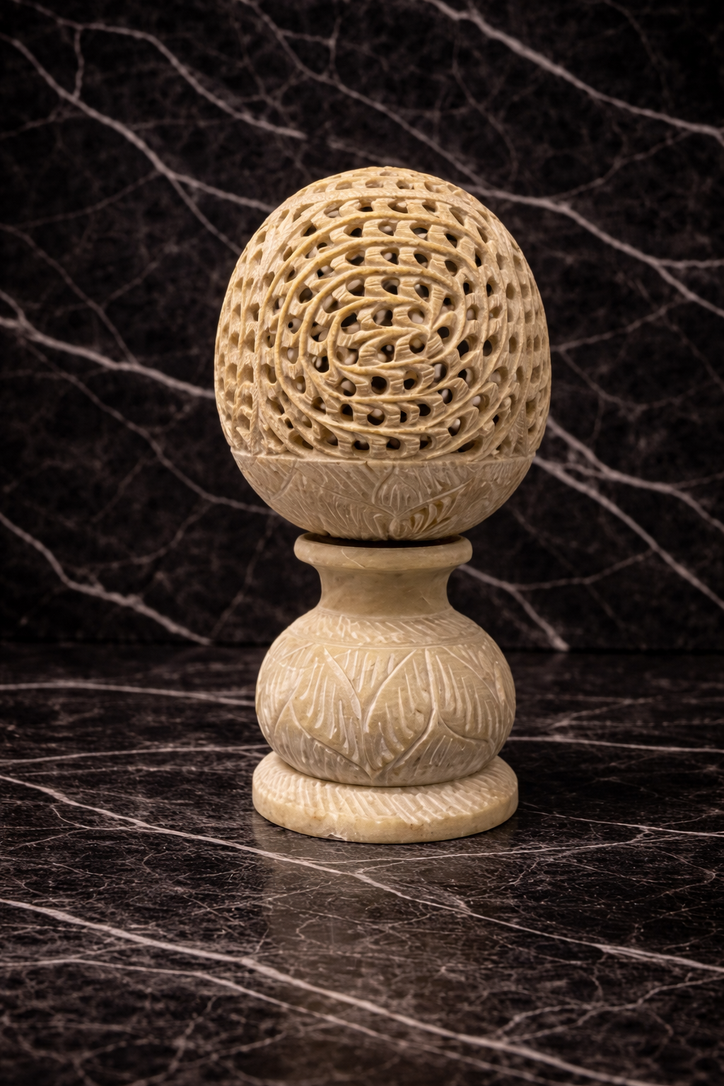 Luxury stone elephant candle holder styled on dark marble surface with ambient candle decor